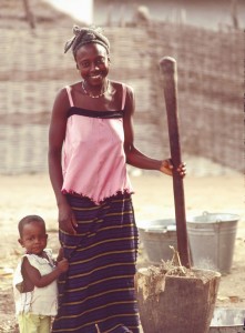 Pounding-Millet Woman with child